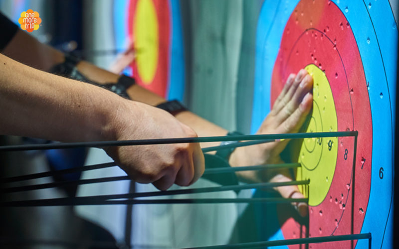 archery class hands removing arrows