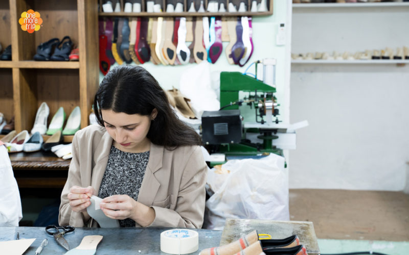 girl in shoe making class