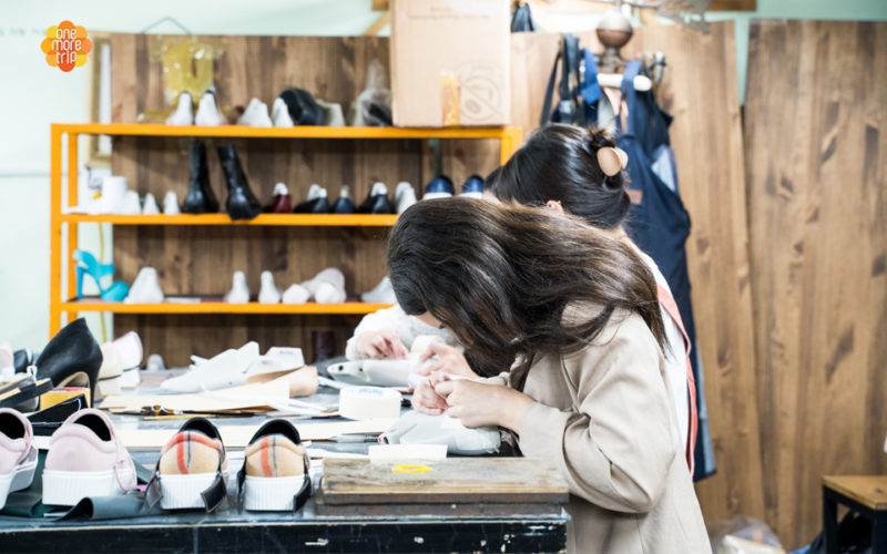 girl sewing shoes