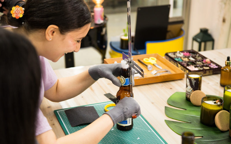 upcycling girl cutting bottle